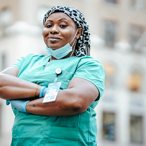Registered Nurse with arms crossed posing at the camera.